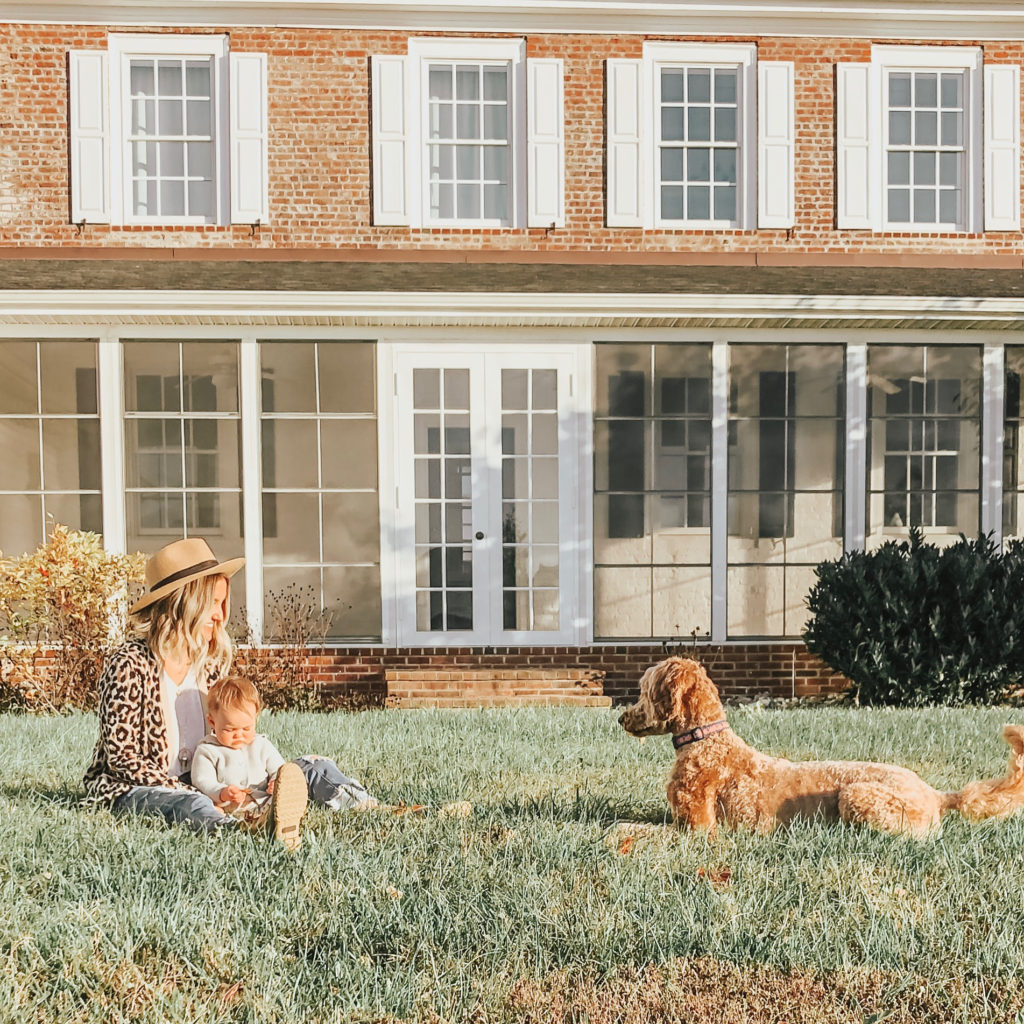 Becca, her daughter, and dog Rosie outside of the farmhouse